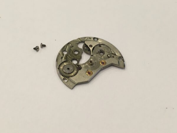 Seiko 5606A barrel and train-wheel bridge part 112560 - Image 2
