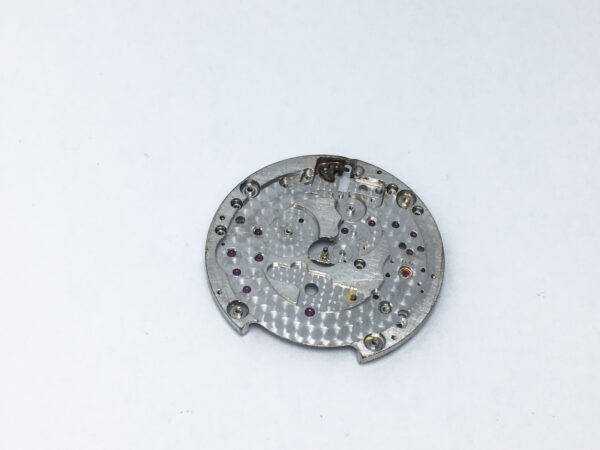 Piaget caliber 12PC main plate with setting lever and center pinion part 100
