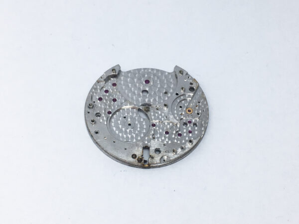 Piaget caliber 12PC main plate with setting lever and center pinion part 100 - Image 3