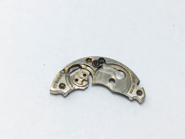 Rolex caliber 10 1/2 6877 barrel bridge part 105