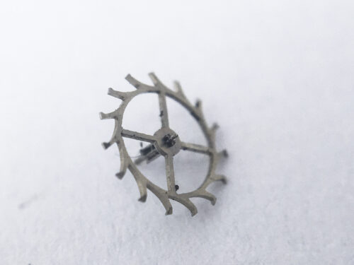 Omega caliber 620 escape wheel and pinion with straight pivots part 1305