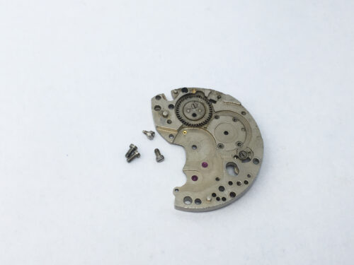 Tissot 872 (Lemania 1277) barrel and train wheel bridge part 106