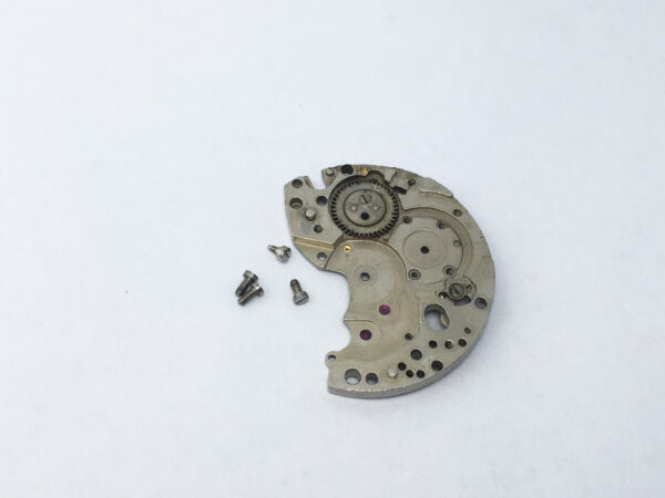 Tissot 872 (Lemania 1277) barrel and train wheel bridge part 106